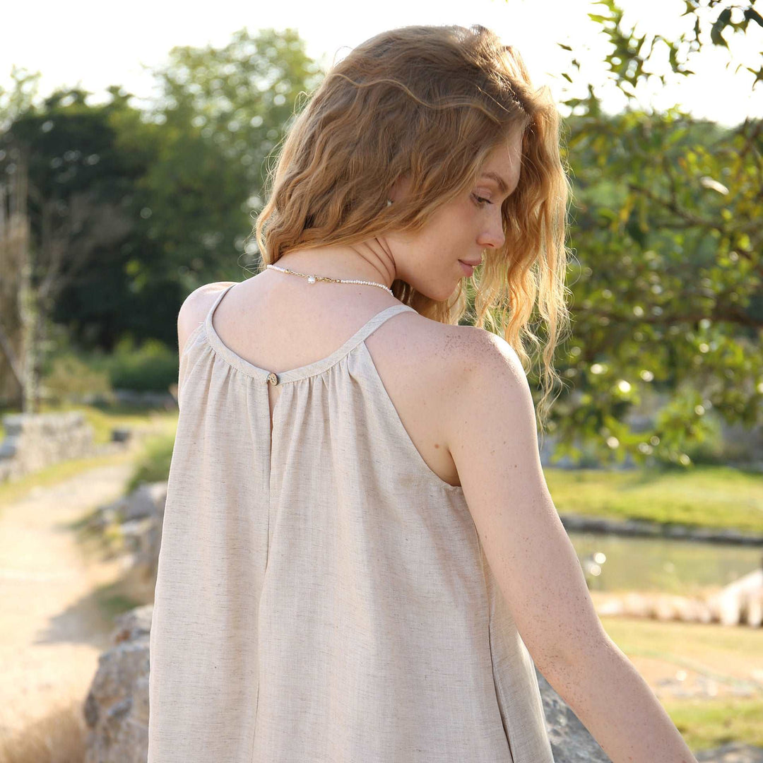 Natural linen dress from VIENI, featuring a relaxed fit and timeless design