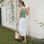 Load image into Gallery viewer, Women&#39;s linen tank top with open back from VIENI, ideal for warm weather fashion
