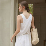 Load image into Gallery viewer, Women&#39;s linen tank top with open back from VIENI, ideal for warm weather fashion
